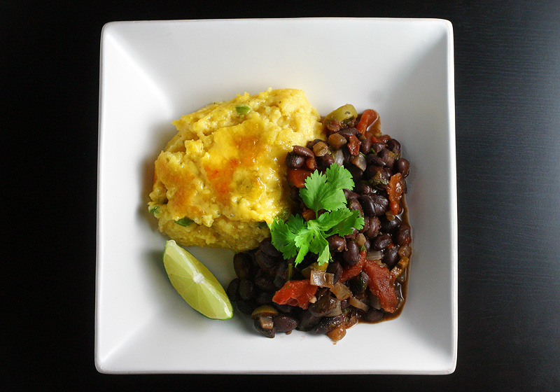 Black Beans w/ Jalapeno Cheddar Polenta Jalapeño cheddar polenta served alongside black beans